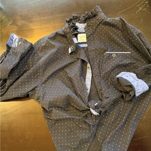 One of a kind up cycled dress shirt with ruffle collar.